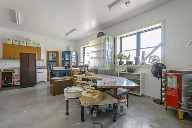 dining space featuring concrete floors