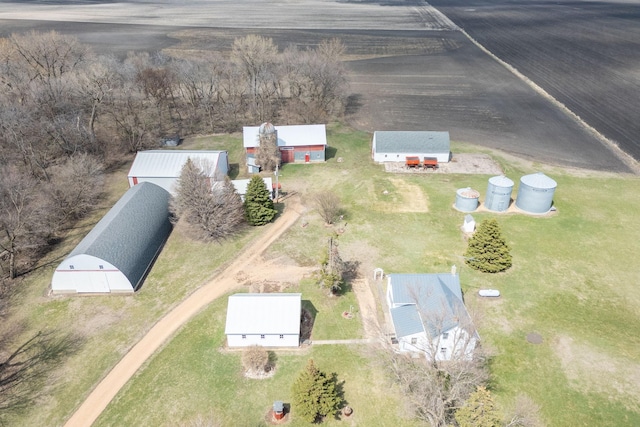 birds eye view of property with a rural view