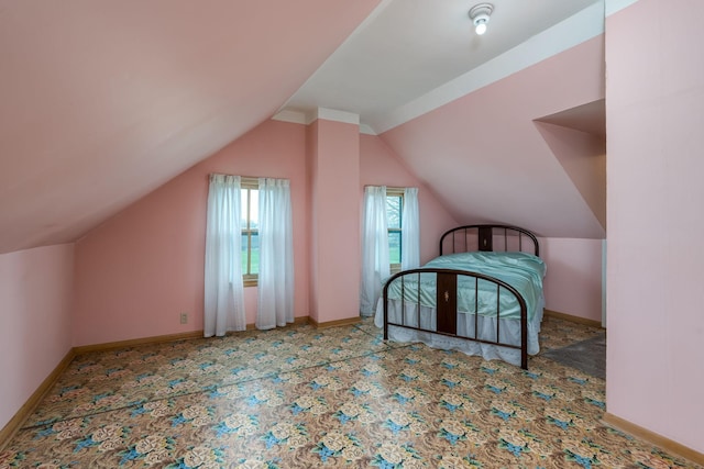 additional living space with vaulted ceiling, carpet flooring, and baseboards