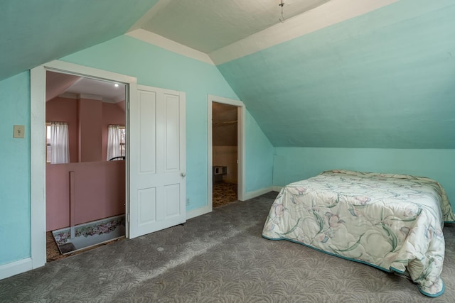 carpeted bedroom featuring vaulted ceiling