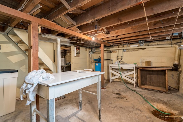 unfinished below grade area with stairway and a workshop area