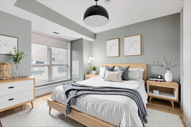 bedroom with light wood-type flooring