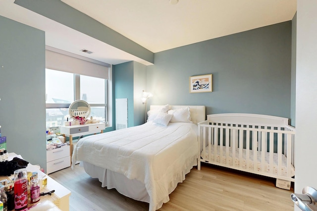 bedroom with wood finished floors