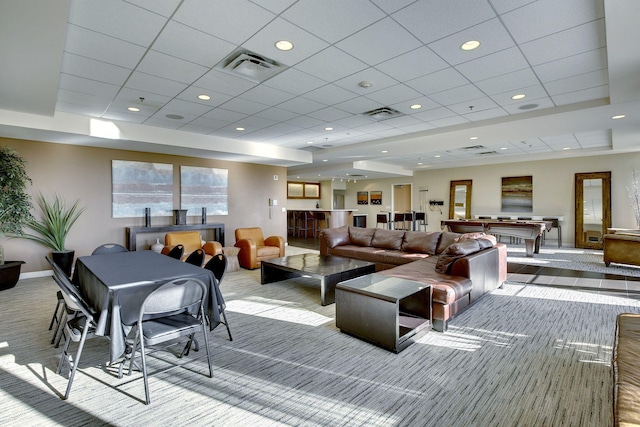 carpeted living area featuring a drop ceiling, baseboards, and billiards table
