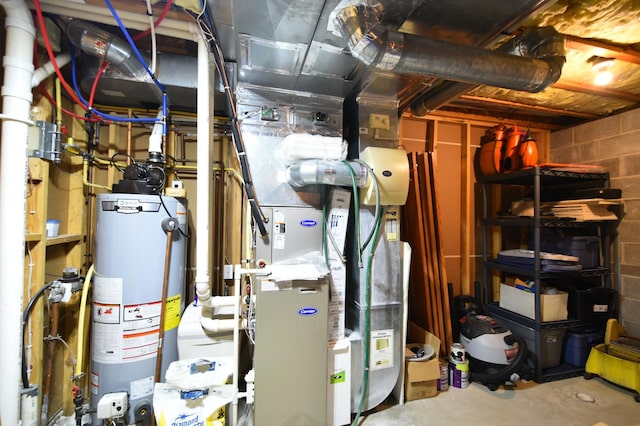 utility room featuring water heater