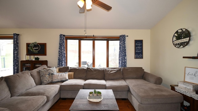 living room with a ceiling fan, a wealth of natural light, lofted ceiling, and dark wood-type flooring