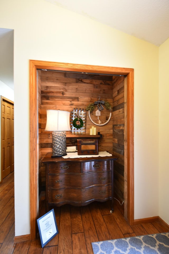 interior space featuring wood finished floors and baseboards