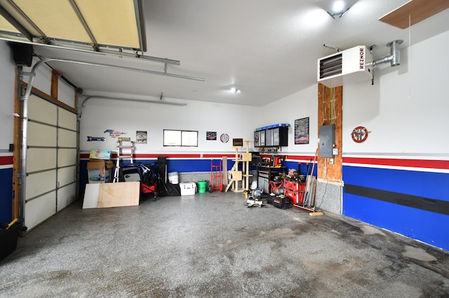 garage with electric panel and a heating unit