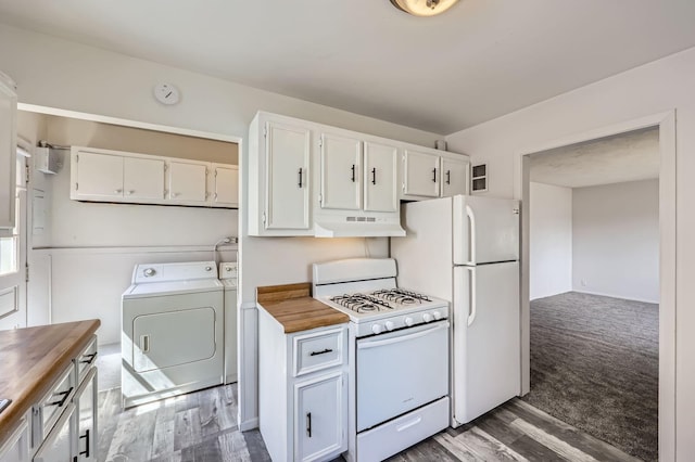 kitchen featuring separate washer and dryer, white appliances, butcher block counters, white cabinets, and under cabinet range hood