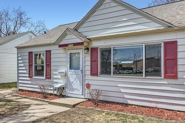 view of front of house featuring roof with shingles