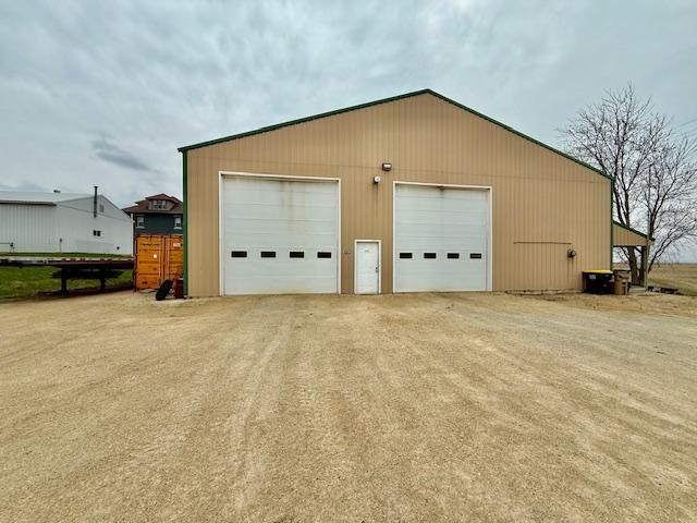 detached garage featuring cooling unit