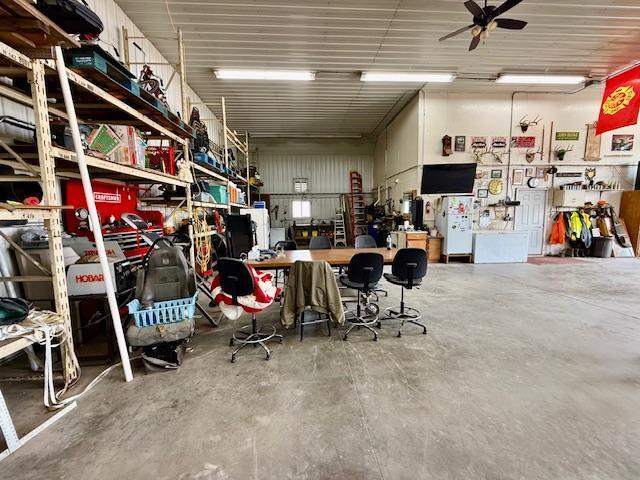 garage featuring a workshop area and ceiling fan