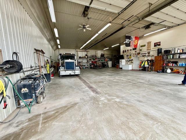 garage featuring a workshop area and ceiling fan