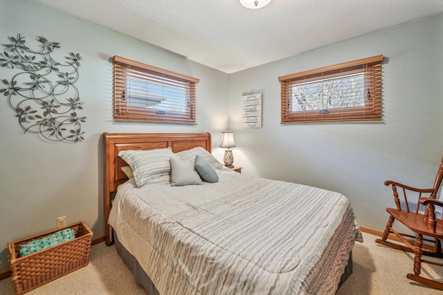 bedroom featuring carpet floors and baseboards