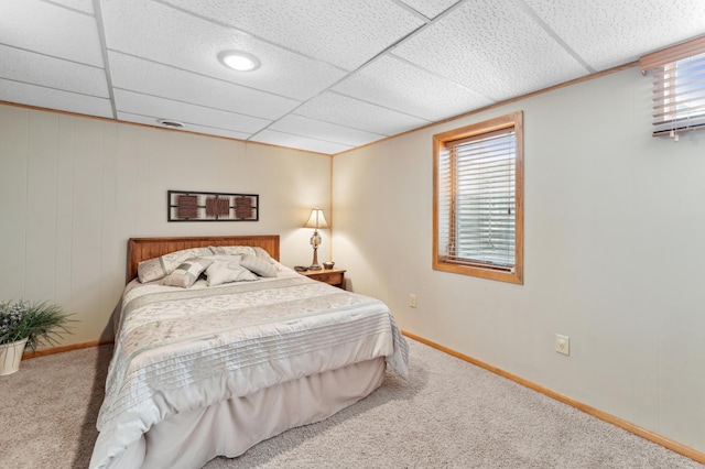 bedroom with baseboards and carpet flooring