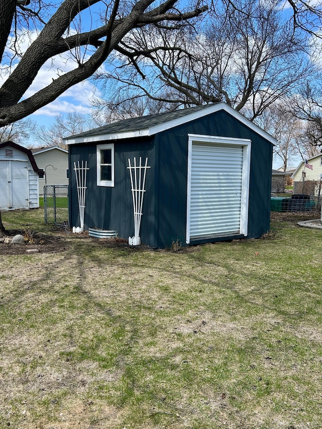 view of shed featuring fence