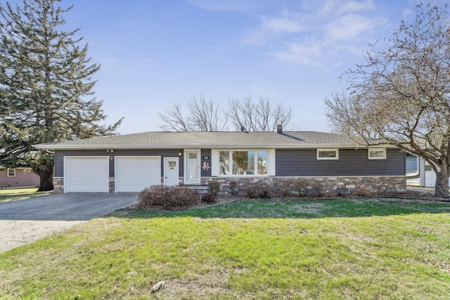 ranch-style home featuring a chimney, aphalt driveway, stone siding, a front yard, and a garage