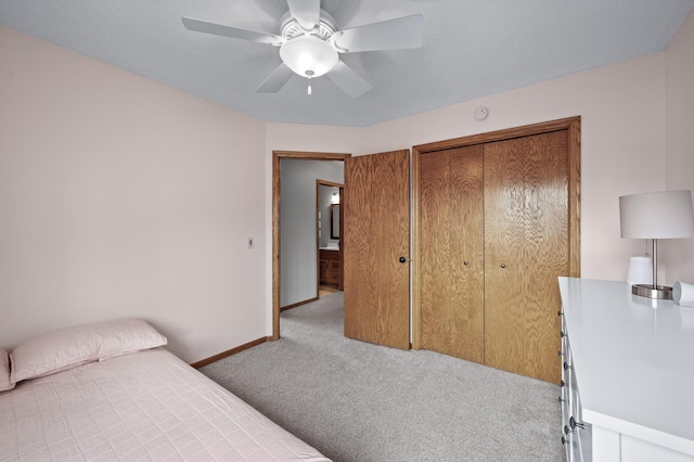 carpeted bedroom with baseboards and a ceiling fan