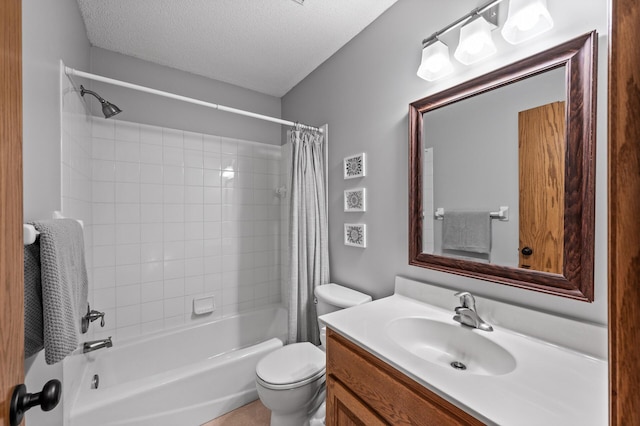 bathroom with vanity, toilet, a textured ceiling, and shower / bath combo with shower curtain