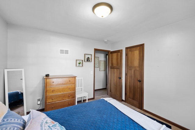 5840 Nevada Ave N, Crystal, MN 55428 - bedroom with wood finished floors and baseboards