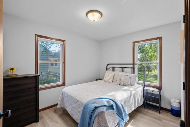 5840 Nevada Ave N, Crystal, MN 55428 - bedroom with light wood-type flooring and baseboards