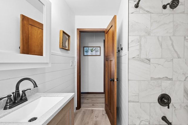 5840 Nevada Ave N, Crystal, MN 55428 - bathroom with a shower, vanity, and wood finished floors