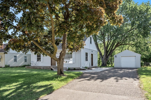 5840 Nevada Ave N, Crystal, MN 55428 - obstructed view of property featuring an outbuilding, a detached garage, a front yard, and asphalt driveway
