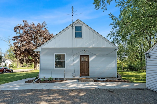 5840 Nevada Ave N, Crystal, MN 55428 - view of front of property featuring board and batten siding, a front lawn, and entry steps