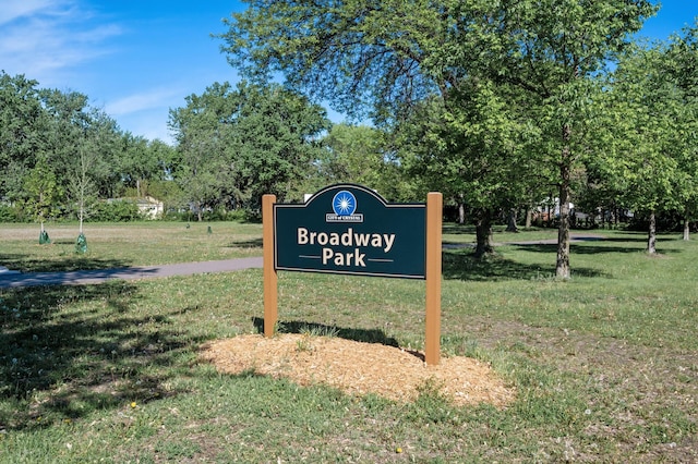 5840 Nevada Ave N, Crystal, MN 55428 - community sign featuring a yard and view of wooded area