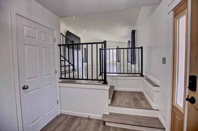 25755 E Comfort Dr, Wyoming, MN 55013 - stairway featuring vaulted ceiling and wood finished floors
