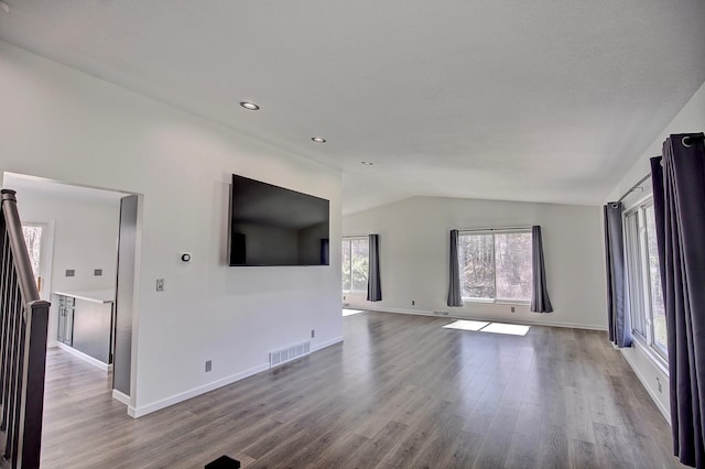 25755 E Comfort Dr, Wyoming, MN 55013 - unfurnished living room featuring recessed lighting, vaulted ceiling, wood finished floors, and visible vents