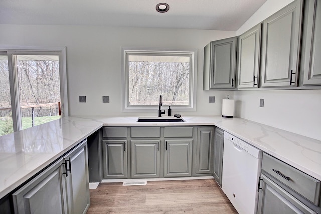 25755 E Comfort Dr, Wyoming, MN 55013 - kitchen featuring dishwasher, light stone counters, gray cabinetry, and a sink