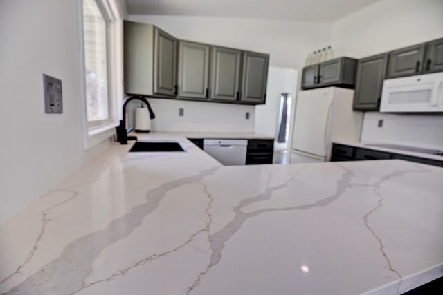 25755 E Comfort Dr, Wyoming, MN 55013 - kitchen with a peninsula, light stone counters, a sink, and white appliances