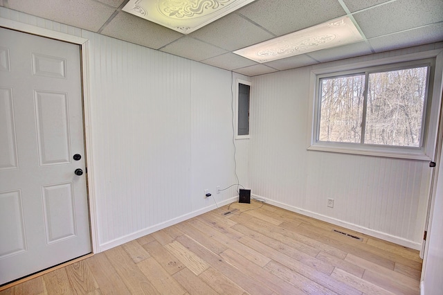25755 E Comfort Dr, Wyoming, MN 55013 - spare room with light wood-style flooring, baseboards, and a drop ceiling