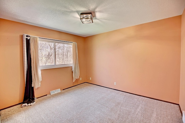 25755 E Comfort Dr, Wyoming, MN 55013 - carpeted empty room featuring baseboards, a textured ceiling, and visible vents