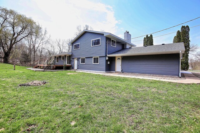 25755 E Comfort Dr, Wyoming, MN 55013 - back of house with an attached garage, a lawn, a chimney, and a deck
