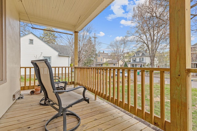 wooden deck with a residential view