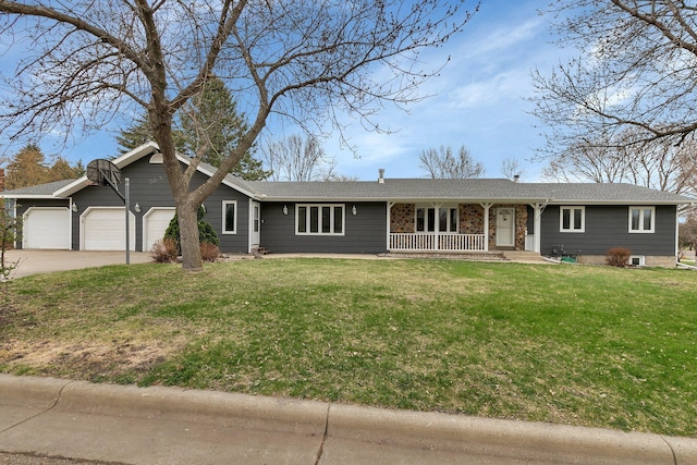 single story home featuring covered porch, concrete driveway, a front yard, and an attached garage