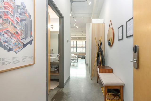 250 Park Ave Unit 601, Minneapolis, MN 55415 - corridor featuring rail lighting and concrete floors