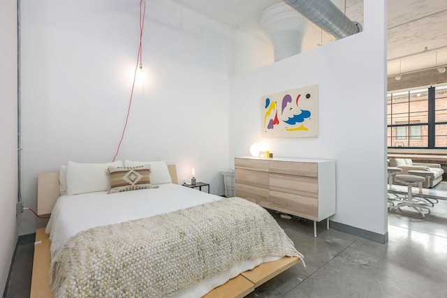 250 Park Ave Unit 601, Minneapolis, MN 55415 - bedroom with concrete flooring and baseboards