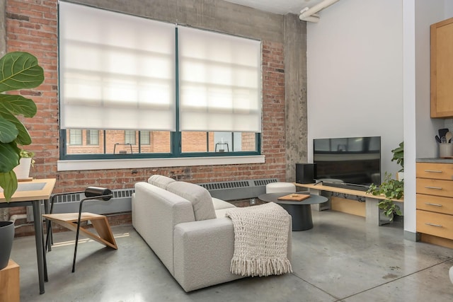 250 Park Ave Unit 601, Minneapolis, MN 55415 - living area featuring concrete floors, brick wall, and radiator heating unit