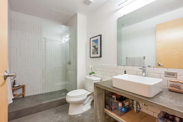 250 Park Ave Unit 601, Minneapolis, MN 55415 - bathroom featuring tile walls, vanity, and walk in shower