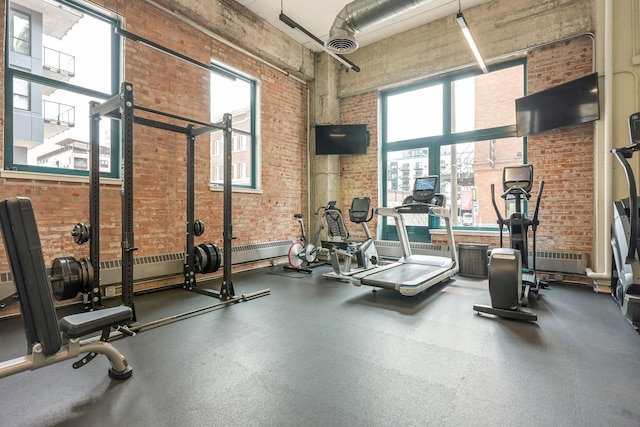 250 Park Ave Unit 601, Minneapolis, MN 55415 - workout area featuring brick wall and a towering ceiling