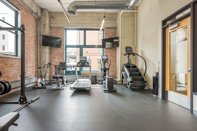 250 Park Ave Unit 601, Minneapolis, MN 55415 - gym featuring brick wall and a towering ceiling