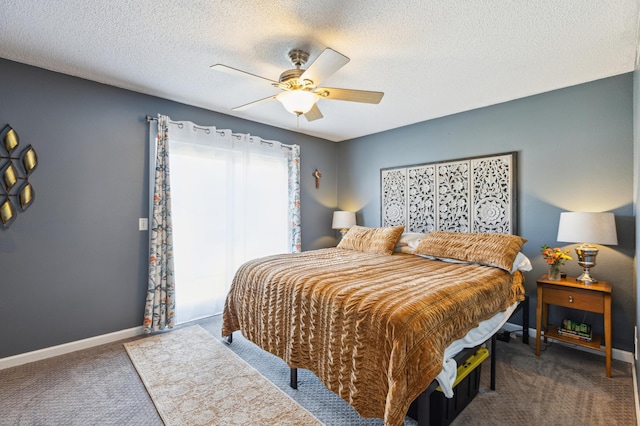 carpeted bedroom with baseboards, ceiling fan, and a textured ceiling