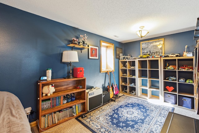 interior space with a textured ceiling, a textured wall, and carpet floors