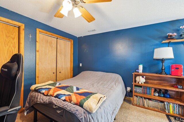 carpeted bedroom featuring ceiling fan