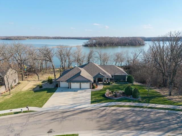 birds eye view of property featuring a water view