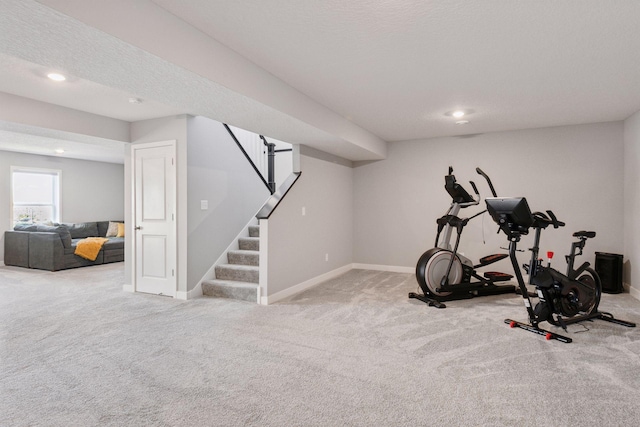 exercise area featuring baseboards, carpet floors, and recessed lighting