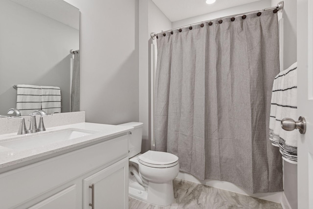full bathroom with toilet and vanity